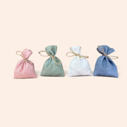Ballotins de dragées Maison Fruidoraix en sachets de lin colorés avec lien en ficelle pour cadeaux d'invités