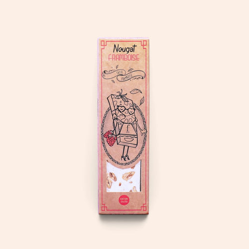 Barre de nougat framboise Maison Fruidoraix dans son emballage en carton kraft illustré avec fenêtre transparente