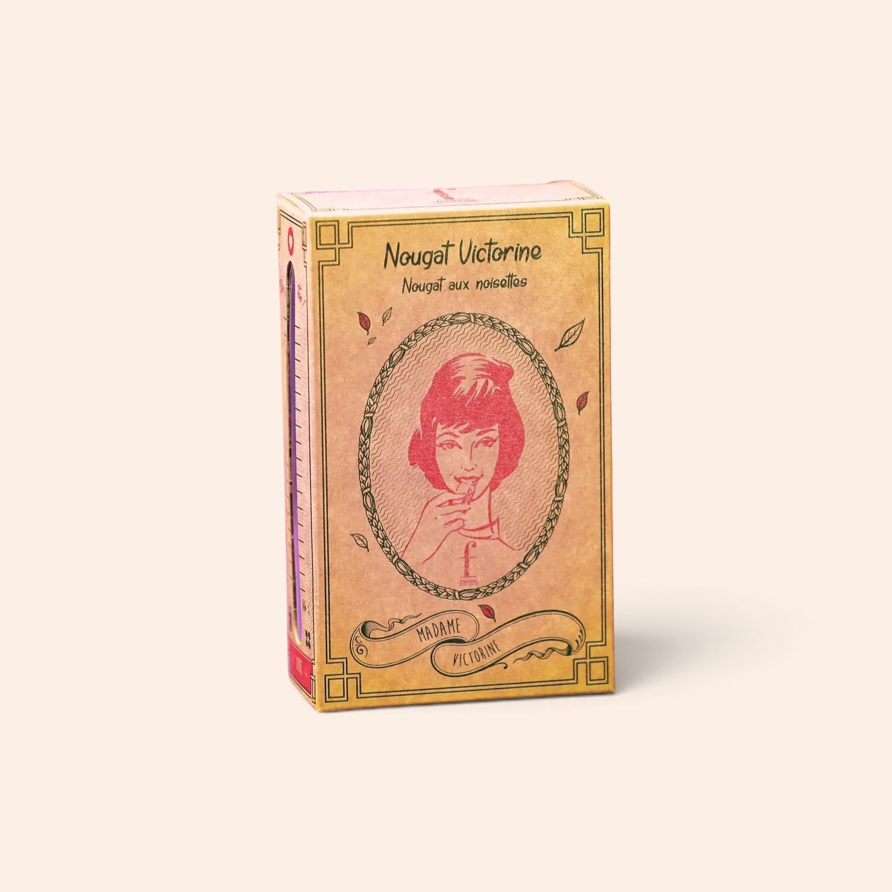 Boîte de nougat aux noisettes Maison Fruidoraix avec illustration vintage de Madame Victorine sur fond beige