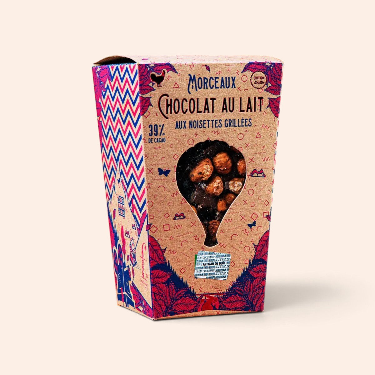 Boîte de morceaux de chocolat au lait Maison Fruidoraix avec noisettes grillées et emballage illustré coloré