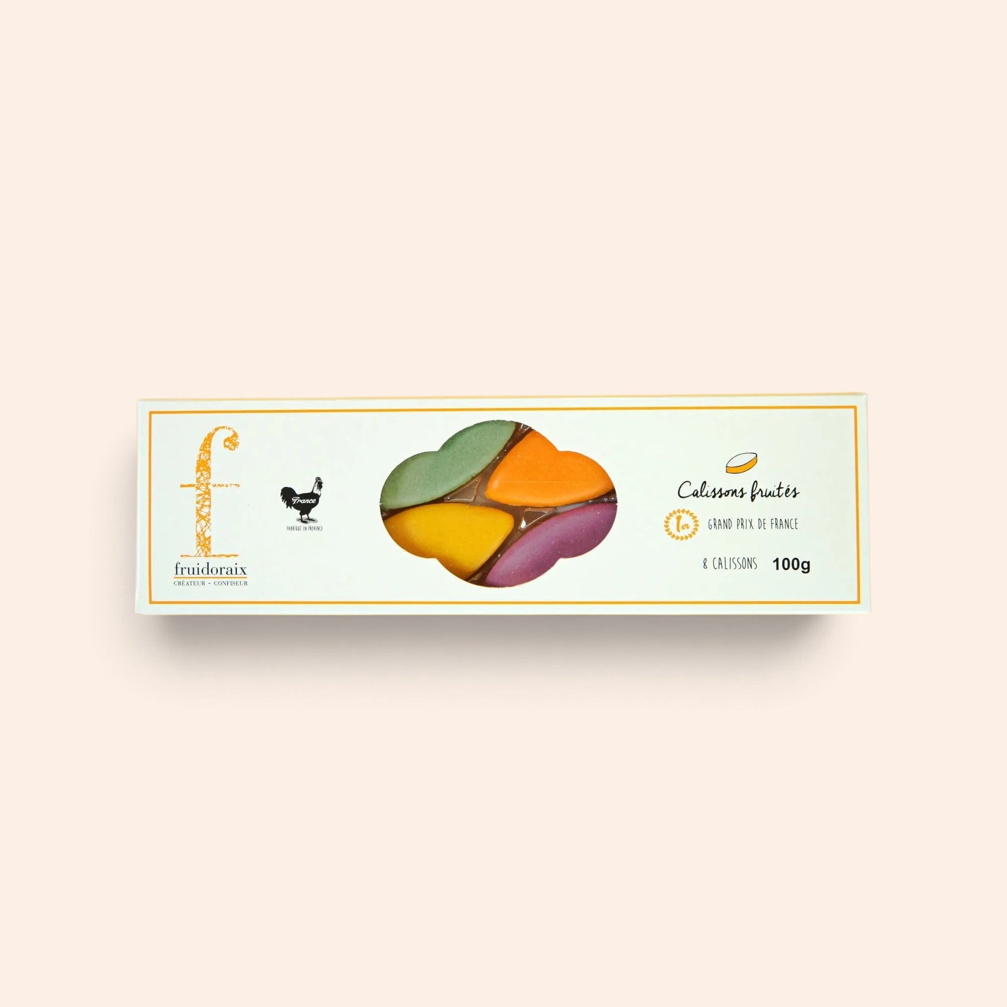 Étui de 100g de calissons fruités Maison Fruidoraix aux couleurs variées, incluant cassis, abricot, citron et pistache.