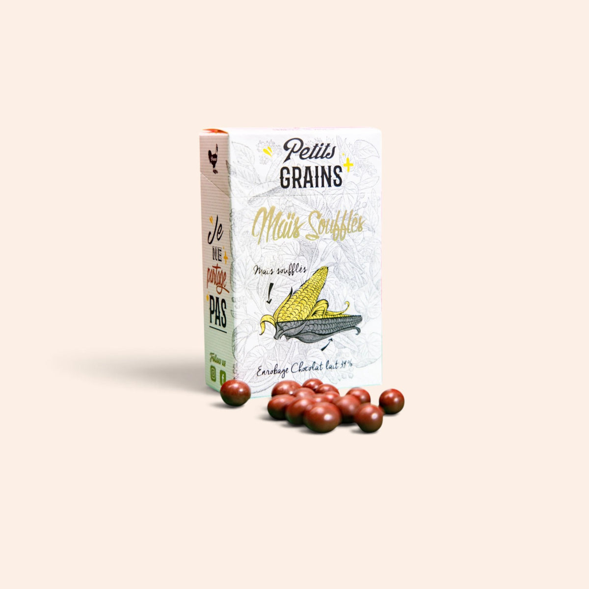 Boîte de Maison Fruidoraix contenant des grains de maïs soufflés enrobés de chocolat au lait croquant