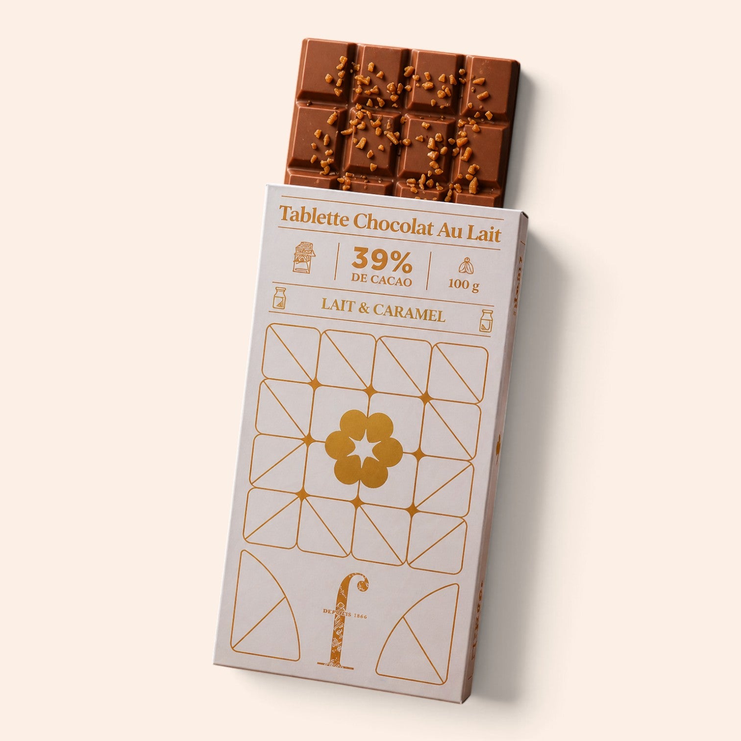 Tablette de chocolat au lait et éclats de caramel Maison Fruidoraix dans son emballage élégant